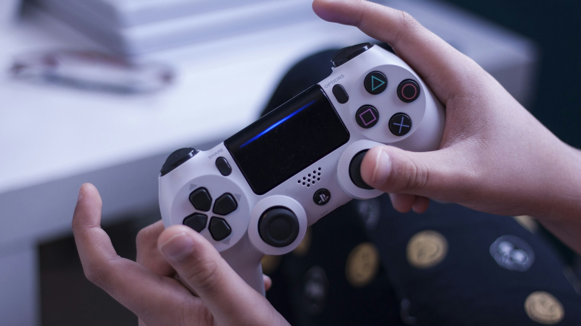 Iron Game Chronicle editor's desk with retro consoles
